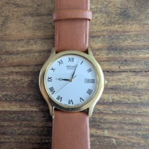Seiko Quartz 7N22-7A30 | Gold-Tone Dress Watch | White Dial Roman Numerals | Date | Pre-Owned